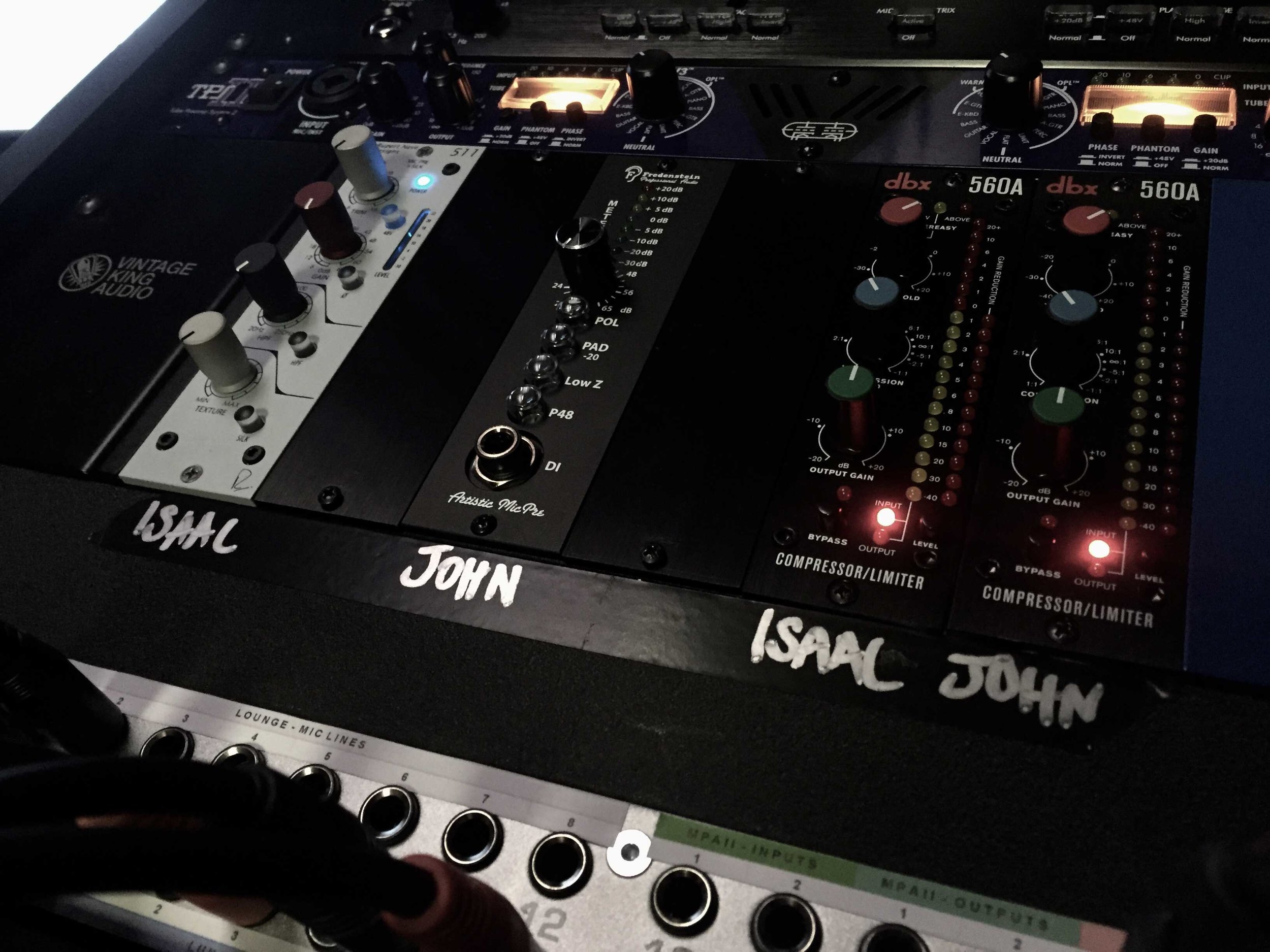 The recording studio console labeled for Isaac and John